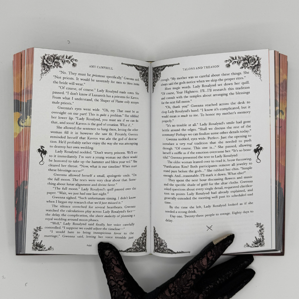 Talons & Treason interior pages with ornate dragon flourishes and decorative corners